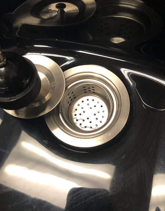 Close-up of Luxe Lather portable shampoo bowl showing faucet, sprayer, and basin design