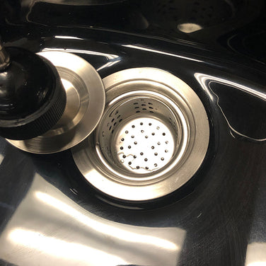 Close-up of Luxe Lather portable shampoo bowl showing faucet, sprayer, and basin design