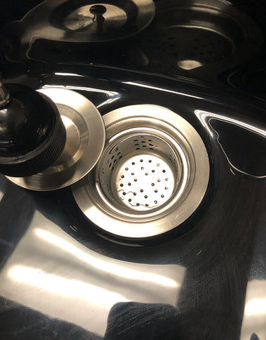 Close-up of Luxe Lather portable shampoo bowl showing faucet, sprayer, and basin design